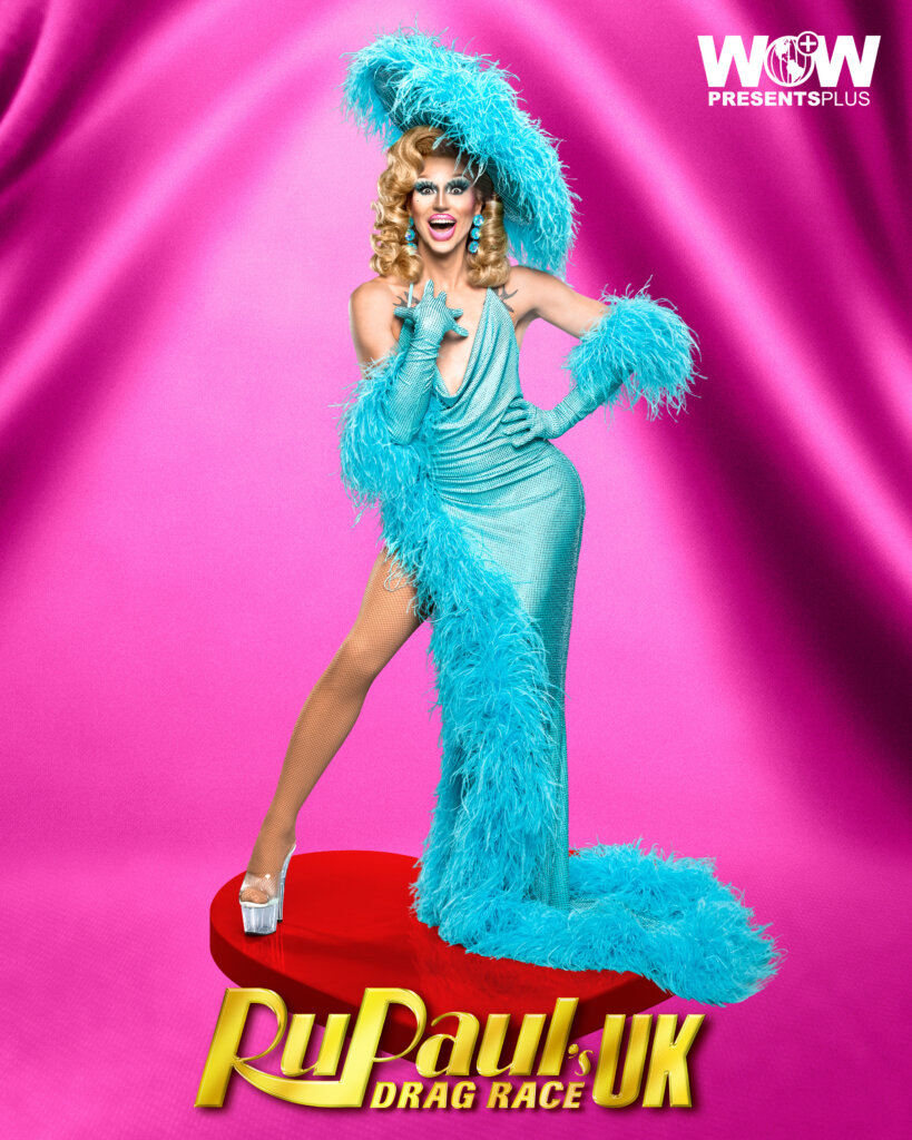 Vicki Vivacious posing for RuPaul's Drag Race UK series 5 promo for Meet The Queens in a sky-blue outfit.