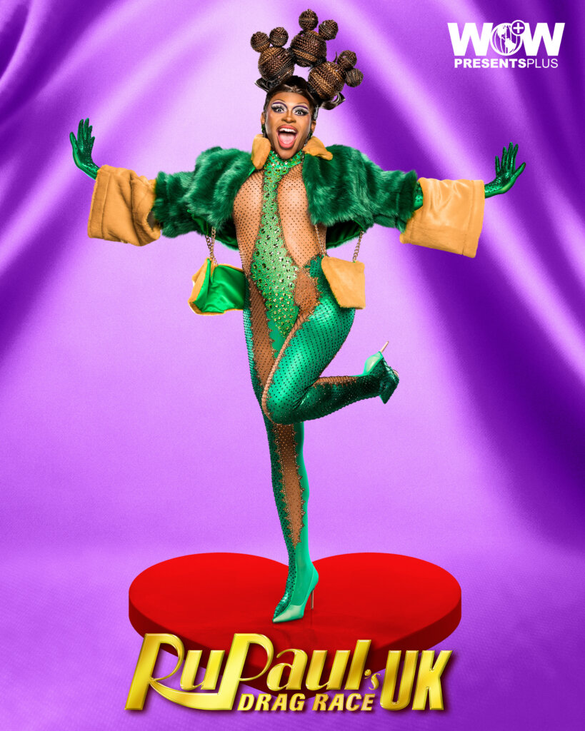 Miss Naomi Carter posing for RuPaul's Drag Race UK series 5 promo for Meet The Queens in a green outfit.