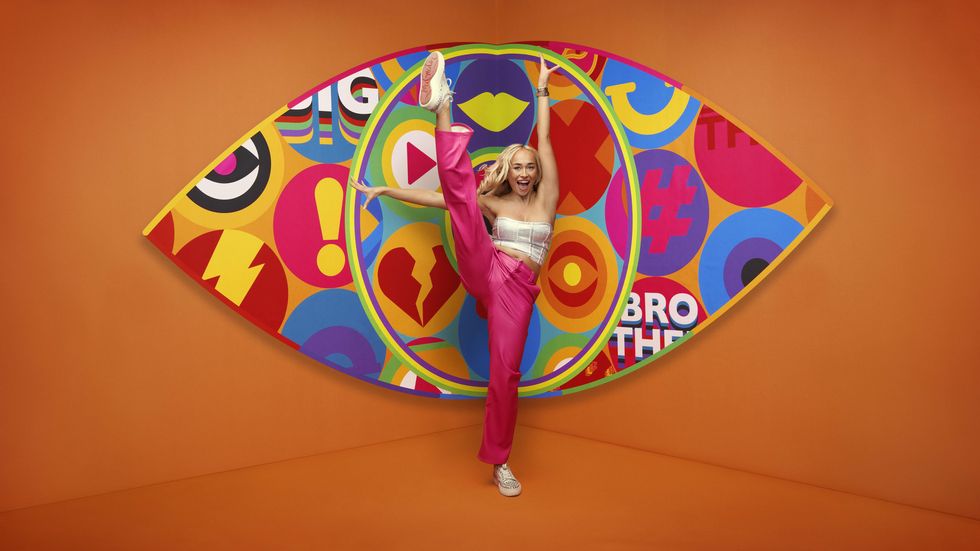 Big Brother 2023 housemate Olivia standing in front of the new eye logo with a bright orange background.