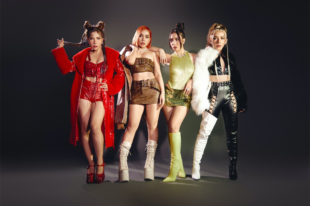 Promotional photo for "Distorted" which sees 4th Impact pose together in a dark studio wearing bright outfits and showcasing powerful stances.