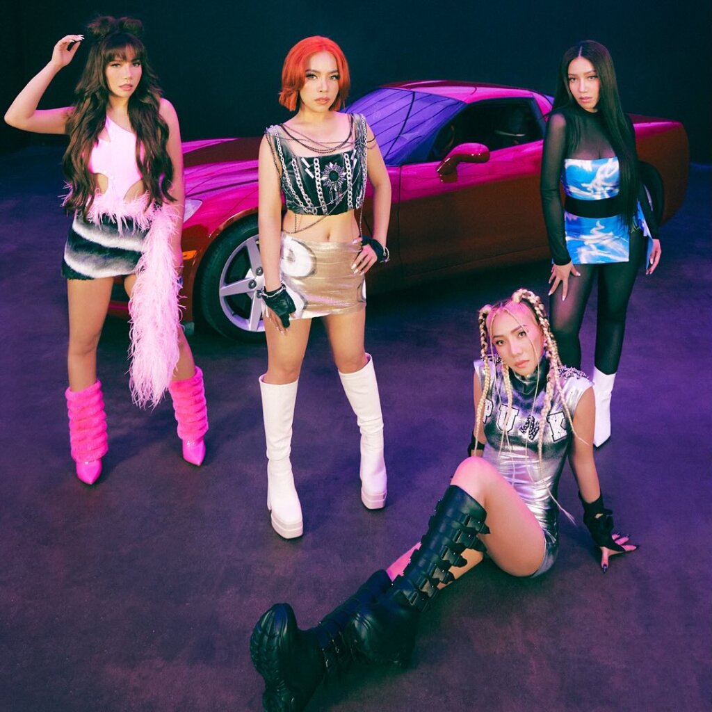 Promotional photo for "Distorted" which sees 4th Impact giving power stances in front of a red Corvette.