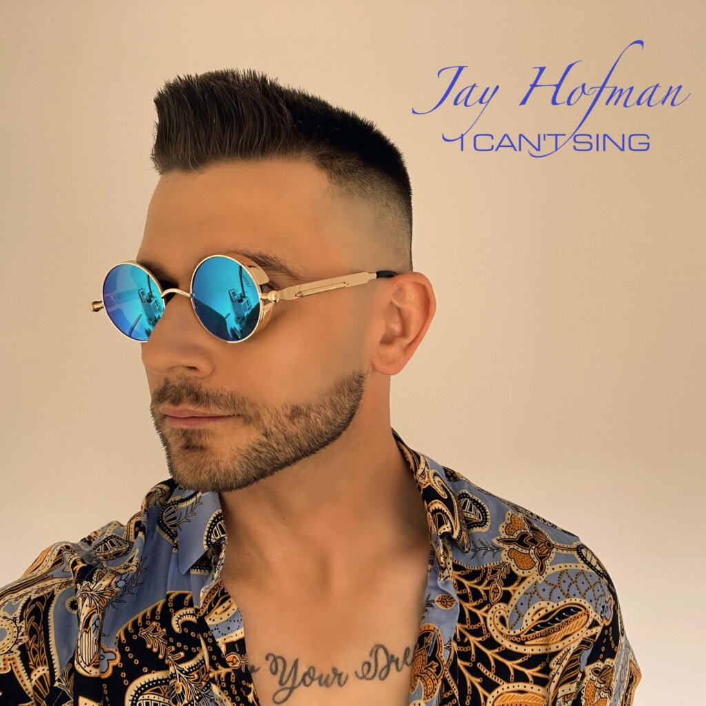 Official single cover artwork for "I Can't Sing" which sees Jay Hofman facing slightly to the left, wearing a light-blue patterned-gold shirt, and blue shades.