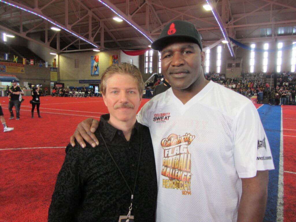 Rich Campanella posing with a tall black guy who has his hand around Rich. They are both smiling.