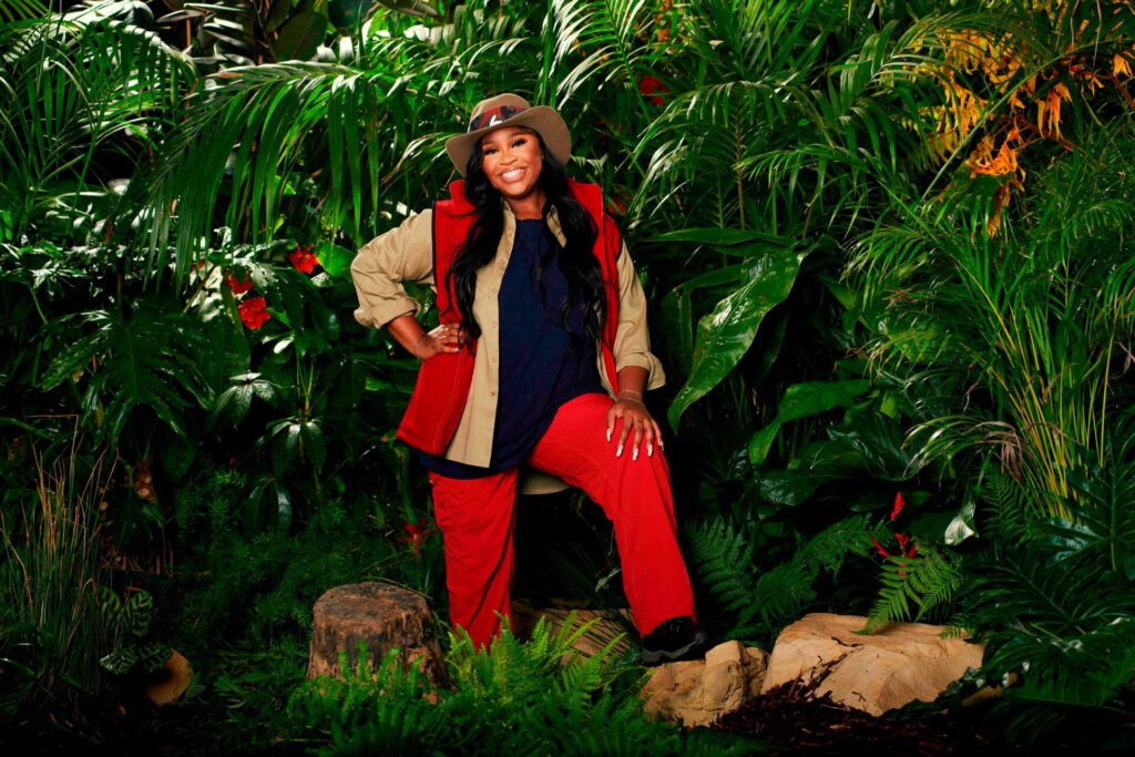 Promotional photo for I'm a Celebrity… Get Me Out of Here! 2023, which sees Nella Rose in a jungle setting, wearing the camp uniform.