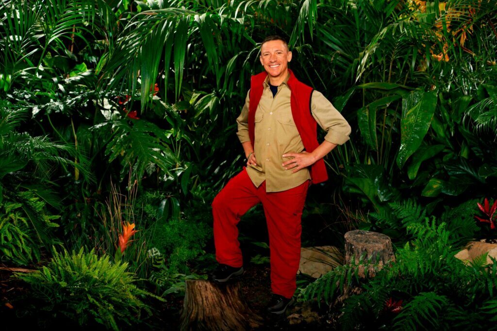 Promotional photo for I'm a Celebrity… Get Me Out of Here! 2023, which sees Frankie Dettori in a jungle setting, wearing the camp uniform.