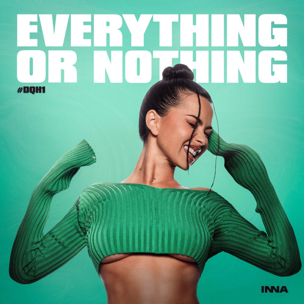 Official album artwork for the EP "Everything or Nothing" which sees INNA wearing a green crop-top jumper that shows under boob, with her head turned to the right with a grin on her face, full of happiness, as a line of hair falls down her face, while the rest of her hair is in a bun.