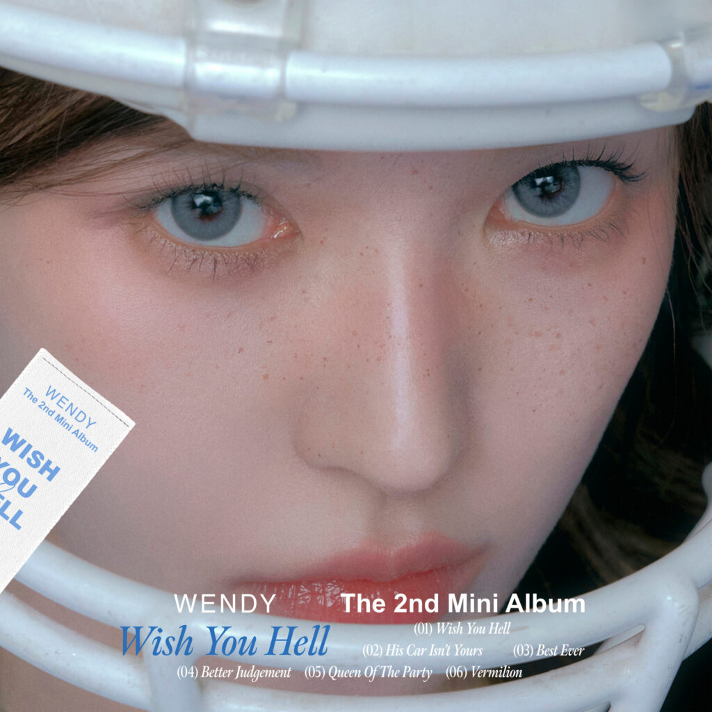 Official album artwork for "Wish You Hell" which is a close-up of WENDY's face wearing the American Football helmet.