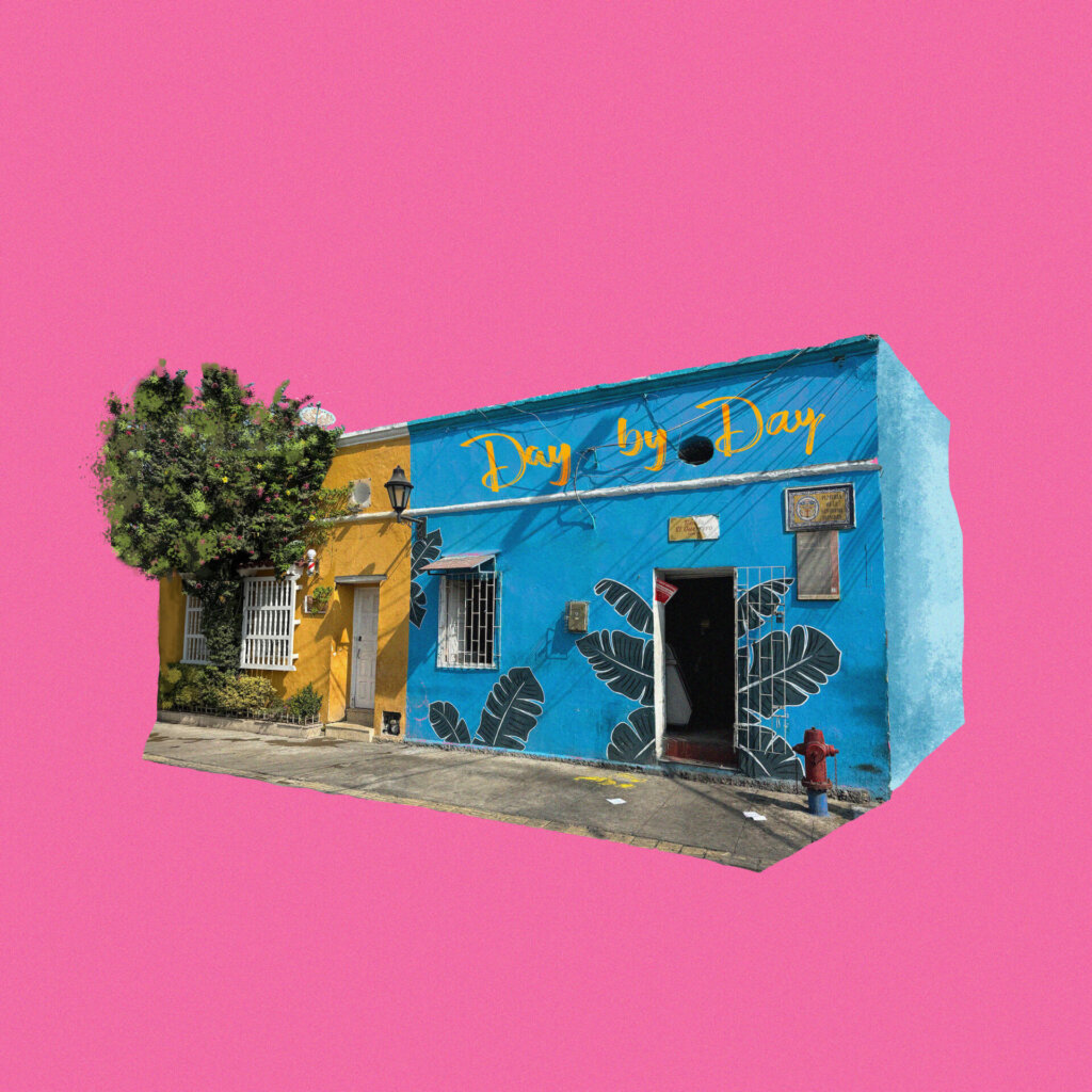 Official single cover artwork for Jeffrey James' "Day by Day" which is a pink background with a blue building next to a yellow building which has a tree outside, with the song's title in yellow over the top of the blue building.