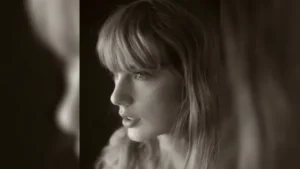 Black and white head-shot photo of Taylor Swift looking to the left.