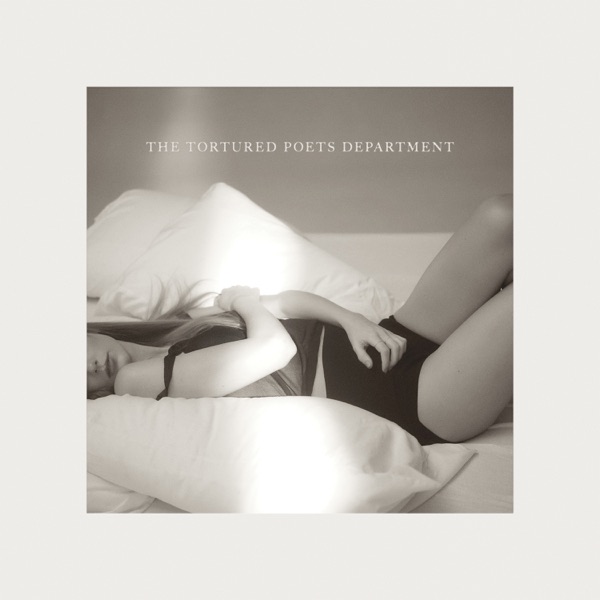 Official album artwork for "The Tortured Poets Department" which sees a light cover with a black and white photo of Taylor Swift lying on a bed.