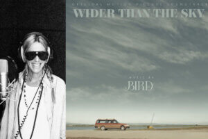 A collage of two photos with a black and white photo of Bird on the left, recording music in a studio, with the microphone to her right and she's smiling at the camera, wearing shades; and the official album artwork of "Wider Than The Sky" to the right which shows a car driving on a dirt road with a teal-coloured sky with wispy slight clouds as the main focal point.