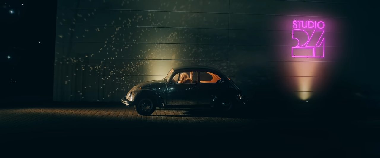 The opening scene from the "Call Me" music video by Cascada which sees Natalie Horler drive and park her Volkswagen Beetle outside a nightclub titled "Studio 24".