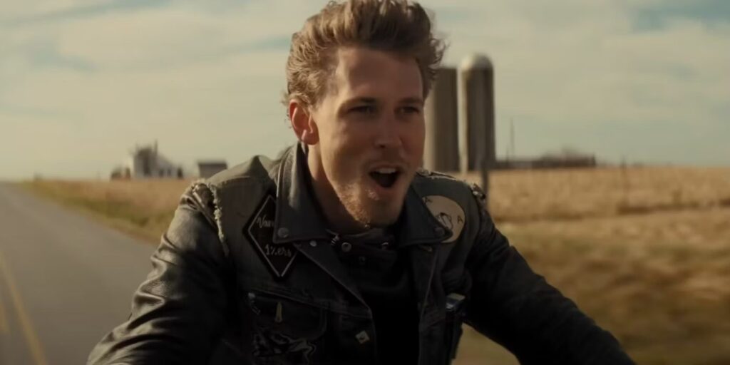 Austin Butler playing Billy as he rides his motorcycle on the open road, joyfully screaming with adrenaline.