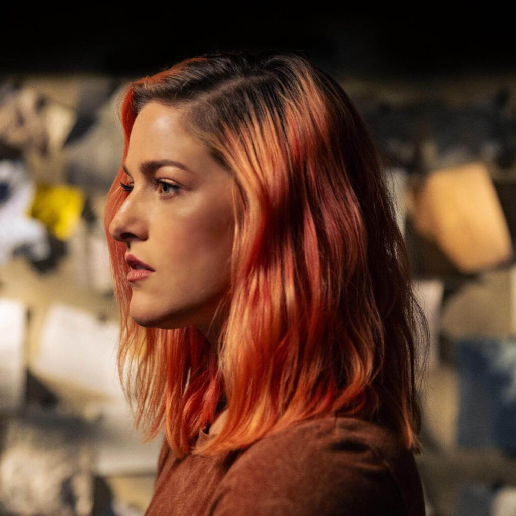 Single cover artwork for "Three of Us", which sees Cassadee Pope facing to the left as her copper hair fall just past her shoulders.
