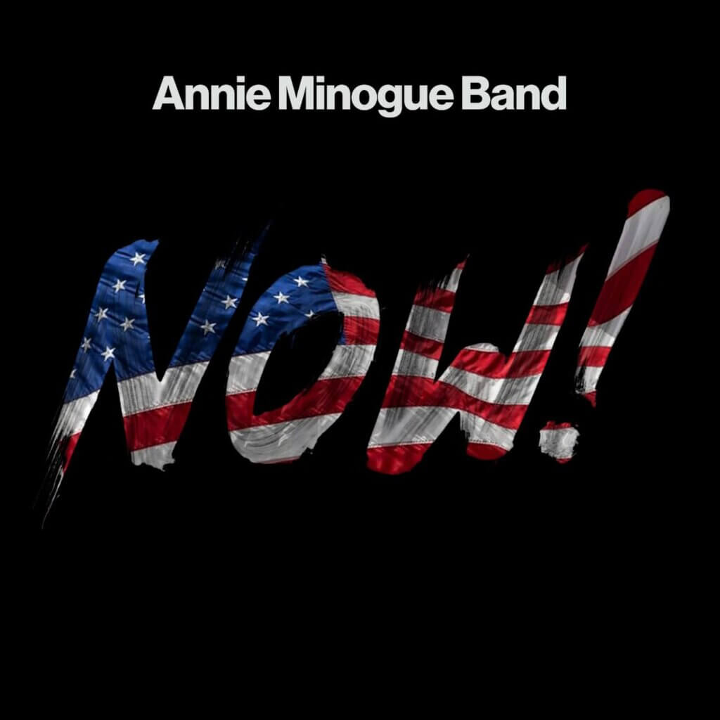 The official single cover artwork for "NOW!" which showcases the song's title on a black background which is cutout and made to look like the American flag is behind it, showing up where the song's title is.