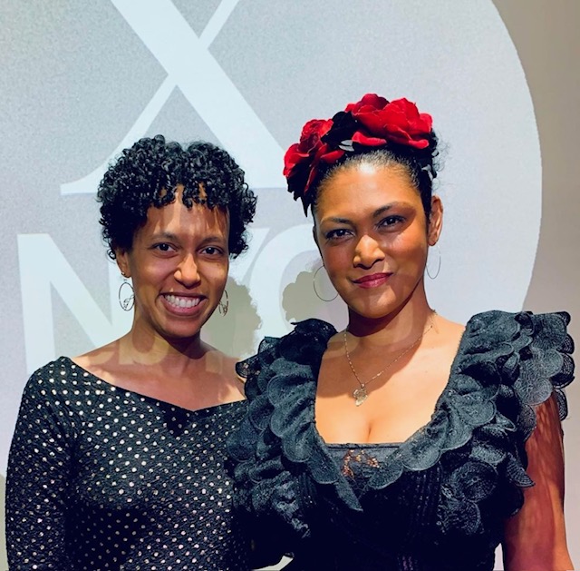 Lauren Atkins posing with MelimeL at a NYC Web Fest, both are wearing black dresses.