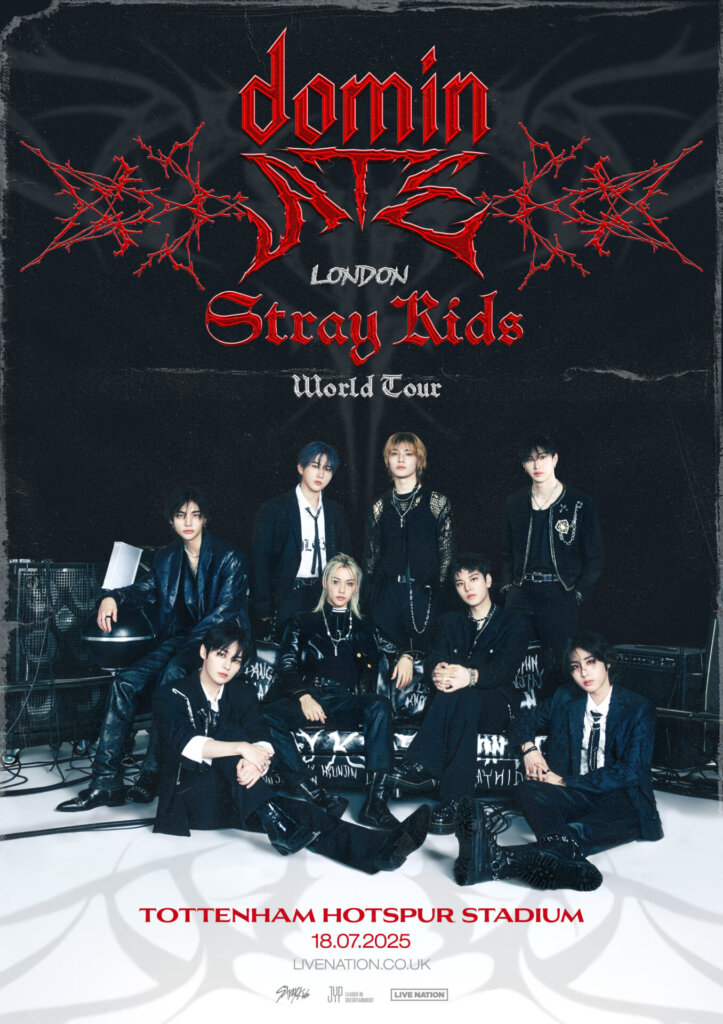 Official Stray Kids' World Tour London poster which shows a huge image of Stray Kids posing together, dressed in black, with the writing about the London show in red.